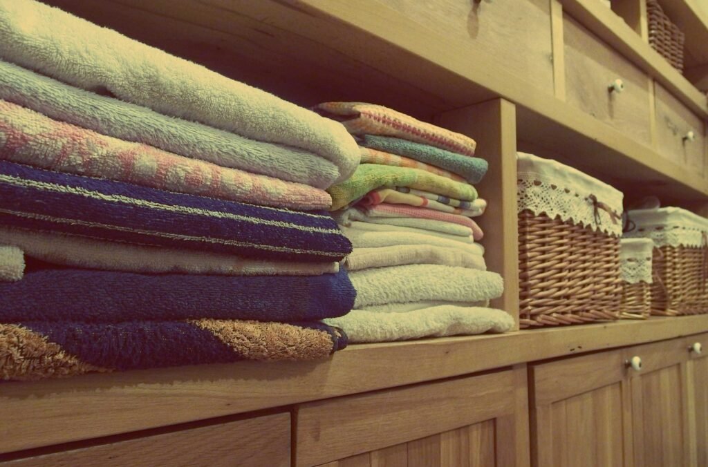 Clean dog towels stored in a compact home storage area