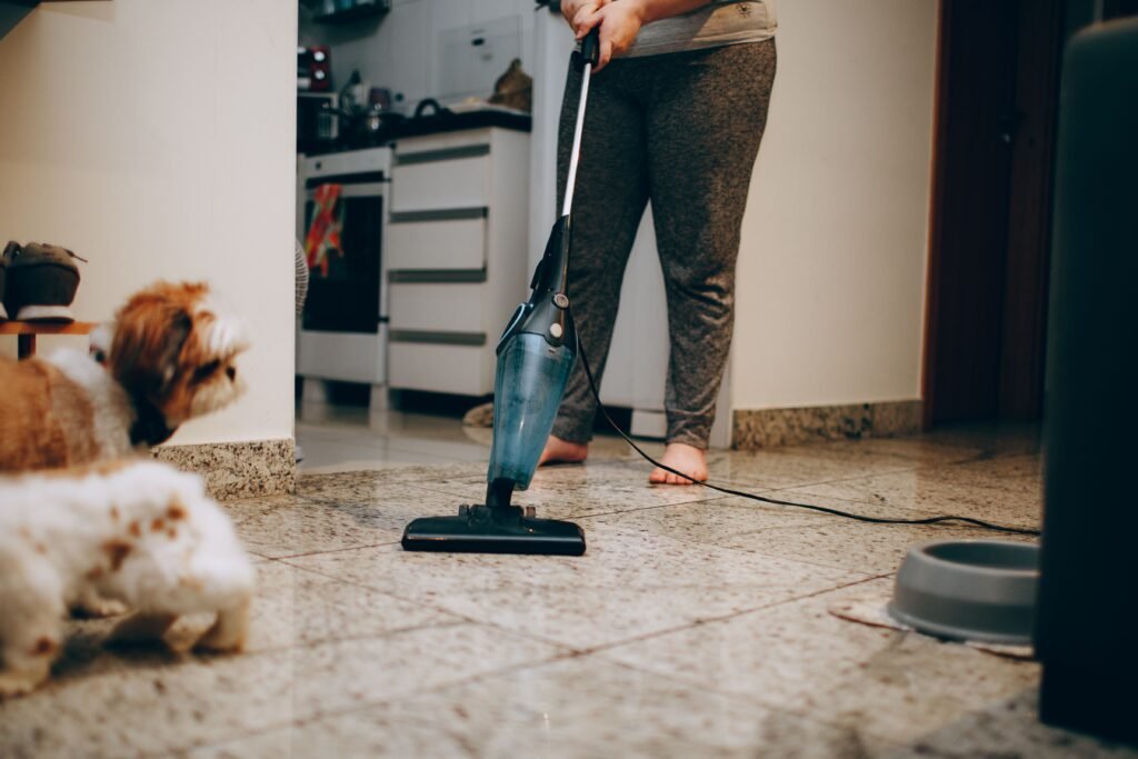 Vacuuming dog hair from a floor